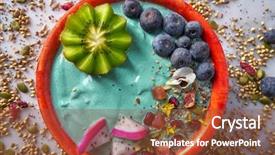  Presentation with pitaya - Audience pleasing presentation consisting of green blue purple berries - acai bowl smoothie with kiwi backdrop and a tawny brown colored foreground