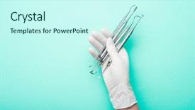  Presentation with hand tools - Amazing theme having green dentistry - hand in glove holding dental backdrop and a cool aqua colored foreground