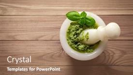  Presentation with basil seeds - Slide deck with green italian homemade sauce pesto in stone pounder made of ground basil garlic pine seeds olives and pecorino sardo cheese top view on darken dooden background background and a coral colored foreground