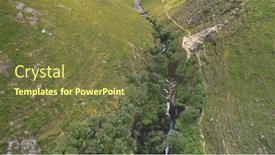  Presentation with cinematic - Audience pleasing PPT theme consisting of green-mountains-path-aerial-rock backdrop and a tawny brown colored foreground