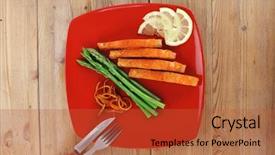 Presentation with cutlery - Presentation theme enhanced with grilled salmon slices with asparagus lemon fried orange peel and cutlery on red plate over wooden table background and a red colored foreground