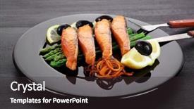  Presentation with cutlery - Colorful presentation enhanced with grilled salmon slices with asparagus lemon olives and cutlery on black plate over dark wooden table backdrop and a dark gray colored foreground