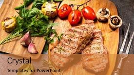  Presentation with veal - Audience pleasing presentation consisting of grilled veal steaks with vegetables on cutting board backdrop and a gold colored foreground