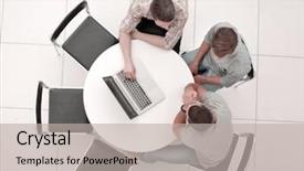  Presentation with round table - Cool new PPT theme with group of people with gadgets backdrop and a light gray colored foreground