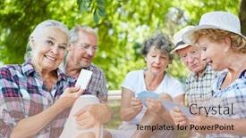  Presentation with playing cards - Colorful PPT theme enhanced with group of retired senior friends playing cards in the park in summer backdrop and a coral colored foreground