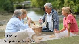  Presentation with people enjoying - Audience pleasing theme consisting of group of senior people enjoying picnic on sunny day backdrop and a coral colored foreground
