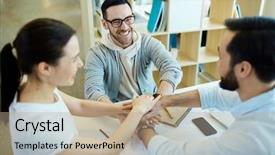  Presentation with business group meeting - Presentation design featuring group of young business people holding hands together and smiling happily cheering during meeting in modern office background and a coral colored foreground