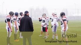  Presentation with football players field - PPT theme having group of young professional american football players with coach discussing strategy together during training match on the stadium field background and a gold colored foreground