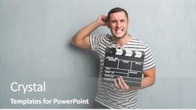  Presentation with clapboard - Audience pleasing PPT theme consisting of grunge wall holding movie clapboard backdrop and a gray colored foreground