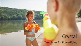  Presentation with water - Audience pleasing PPT theme consisting of guns children - boy sprays girl with water backdrop and a  colored foreground