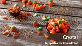  Presentation with halloween candy assorti - Audience pleasing PPT theme consisting of halloween concept colourful candies backdrop and a tawny brown colored foreground