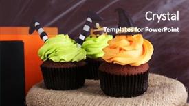  Presentation with cupcakes - Amazing PPT theme having halloween cupcakes and decoration on table backdrop and a tawny brown colored foreground