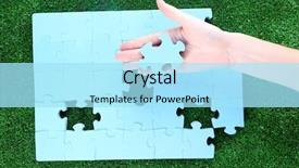  Presentation with hand holding puzzle piece - Theme consisting of hand holding puzzle piece on green grass background background and a arctic colored foreground