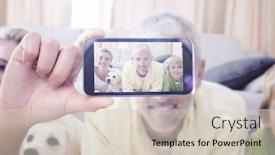  Presentation with children parents - PPT theme with hand holding smartphone showing against happy parents with their children and puppy on floor background and a lemonade colored foreground