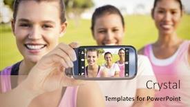  Presentation with breast cancer - PPT layouts having hand holding smartphone showing against three smiling women wearing pink for breast cancer background and a lemonade colored foreground