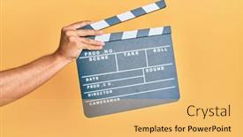  Presentation with clapboard - Audience pleasing PPT theme consisting of hand-of-hispanic-man-holding backdrop and a yellow colored foreground