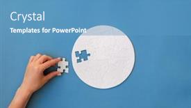  Presentation with hand holding puzzle piece - Theme enhanced with hand-putting-piece-in-round background and a teal colored foreground