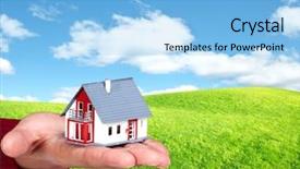  Presentation with house - Presentation with hand with a little house background and a  colored foreground