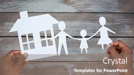  Presentation with family holding hands - Theme enhanced with hands holding a family with her house in paper against wood background and a violet colored foreground