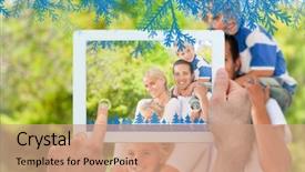  Presentation with family holding hands - PPT theme featuring hands holding tablet pc against happy family in the park background and a coral colored foreground