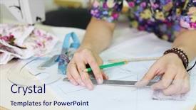  Presentation with patterns - Theme enhanced with hands of female tailor drawing on patterns at paper near white sewing machine background and a sky blue colored foreground