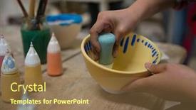  Presentation with pottery - Presentation consisting of hands-of-girl-painting-bowl background and a tawny brown colored foreground