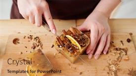  Presentation with cinnamon - PPT theme consisting of hands of girl with knife cutting handmade soap bar with aromatic cinnamon star anise and orange slices background and a gold colored foreground