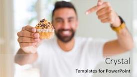  Presentation with muffin - Presentation theme having handsome hispanic man eating chocolate chips muffin very happy pointing with hand and finger background and a white colored foreground