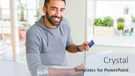  Presentation with online payment - Amazing presentation design having handsome man smiling using credit card as payment metod when shopping online using laptop backdrop and a light blue colored foreground