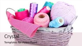  Presentation with few thread bobbin isolated - Amazing presentation having handycraft - bright threads in basket isolated backdrop and a  colored foreground