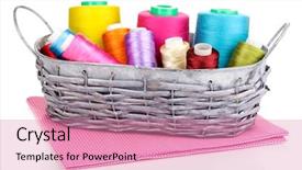  Presentation with few thread bobbin isolated - Presentation featuring handycraft - bright threads in basket isolated background and a  colored foreground