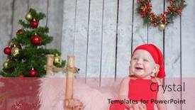  Presentation with new baby - Audience pleasing theme consisting of happy baby dressed in santa claus costume on christmas and new year decoration background studio shot backdrop and a coral colored foreground