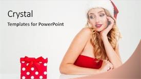  Presentation with santa - Cool new PPT theme with happy beautiful young woman in santa claus hat sitting and looking at present box over white background backdrop and a white colored foreground