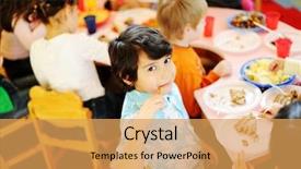  Presentation with children birthday - PPT theme having plate with lettuce chips on wooden table background and a gray colored foreground