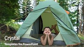 Presentation with camping - PPT theme having happy boy in camping tent background and a tawny brown colored foreground