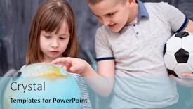  Presentation with childrens - PPT theme with happy childrens boy with soccer ball and little girl learning about the world using globe of earth while standing in front of black chalkboard background and a light blue colored foreground