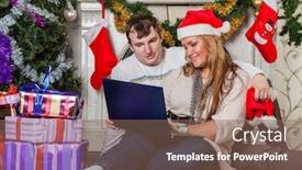  Presentation with family tree - PPT layouts consisting of happy family with notebook sitting near christmas tree at home background and a violet colored foreground