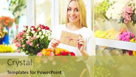  Presentation with congratulation - Slide set consisting of happy florist with congratulation message in small envelope and fresh flowers near by looking at camera background and a yellow colored foreground