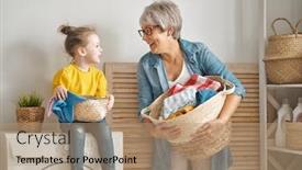  Presentation with grandma - Beautiful slide set featuring happy grandma and child girl little helper are having fun and smiling while doing laundry at home backdrop and a coral colored foreground
