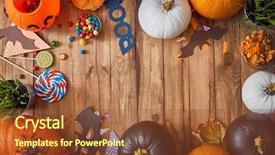  Presentation with halloween candy - Amazing PPT theme having happy halloween carving pumpkin candy backdrop and a tawny brown colored foreground