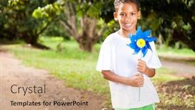  Presentation with pinwheel - PPT theme consisting of happy little boy holding a pinwheel background and a coral colored foreground