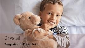 Presentation with hospital bed - PPT layouts having happy-little-boy-hugging-teddy background and a coral colored foreground