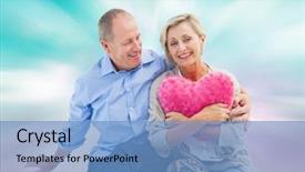  Presentation with pink girly - Colorful PPT theme enhanced with happy mature couple with heart pillow against digitally generated pink and blue girly design backdrop and a teal colored foreground