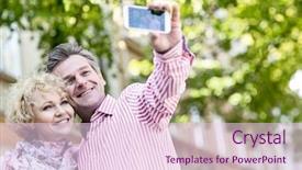  Presentation with selfie - Audience pleasing PPT theme consisting of happy middle-aged couple taking selfie through mobile phone outdoors backdrop and a lemonade colored foreground