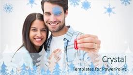  Presentation with house key - PPT theme having happy young couple holding new house key against snowflakes and fir trees background and a sky blue colored foreground