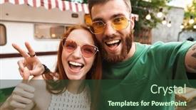  Presentation with selfie - Audience pleasing PPT layouts consisting of happy young couple taking a selfie while standing outdoors with a trailer on a background hugging backdrop and a tawny brown colored foreground