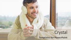  Presentation with cabin - PPT theme consisting of happy young man wearing earmuff with coffee cup against cabin window background and a mint green colored foreground