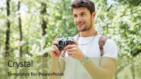  Presentation with old photo - PPT layouts with happy young man with backpack taking pictures with old photo camera in forest background and a mint green colored foreground