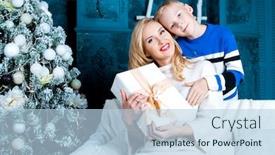  Presentation with christmas presents - PPT theme enhanced with happy young mother and her son at home with a christmas tree and presents background and a light blue colored foreground