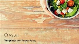  Presentation with young healthy people - Theme consisting of healthy eating dieting and people concept - close up of young woman hands with salad bowl on blank table at home background and a lemonade colored foreground